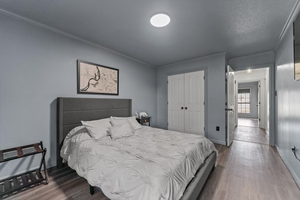 3358 Altruria Road Bartlett, TN 38135 - Photo 19 of 28 a bedroom with a bed and painting on the wall