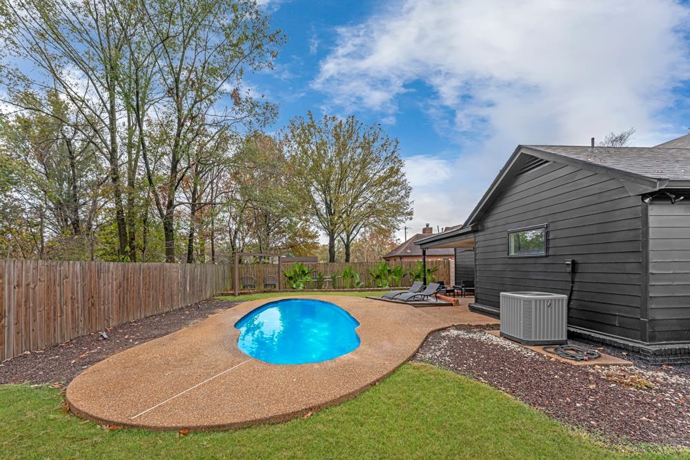 3358 Altruria Road Bartlett, TN 38135 - Photo 27 of 28 a view of a backyard with table and chairs and wooden fence