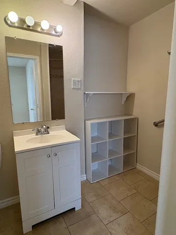 a bathroom with a sink and a mirror