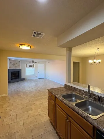 a kitchen with a sink and cabinets