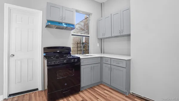 a kitchen with a stove and a refrigerator