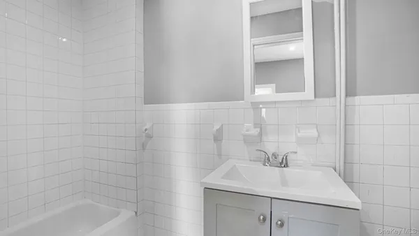 a bathroom with a sink toilet and tub