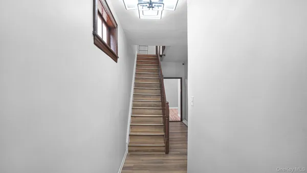 a view of a hallway with stairs