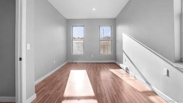 a view of entryway with wooden floor and fan