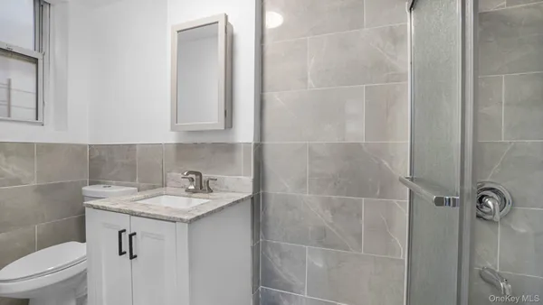 a bathroom with a sink toilet and vanity
