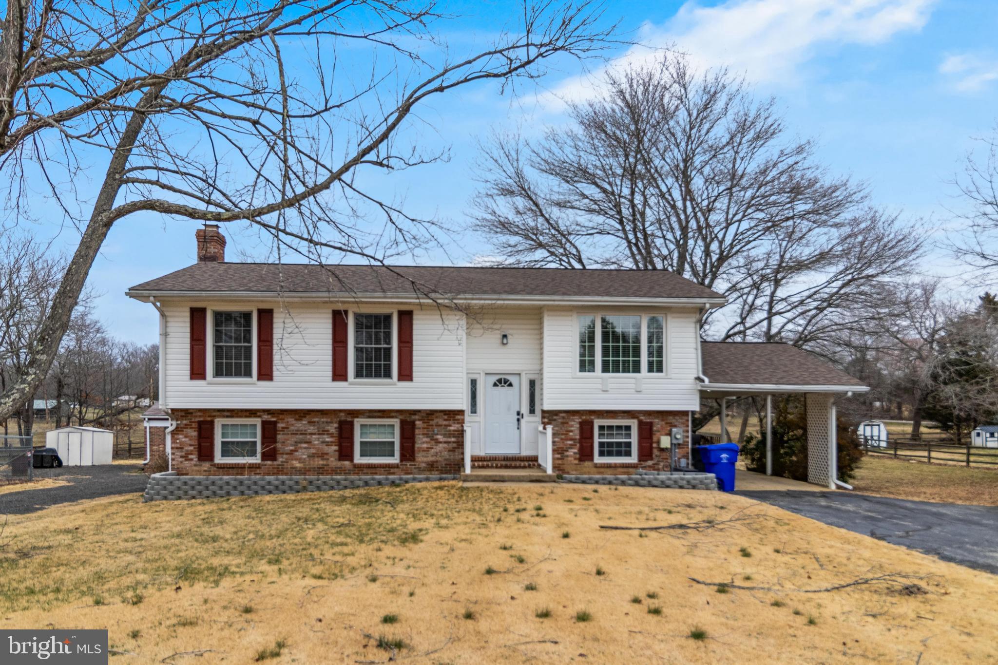 5510 Raphael Drive Pomfret, MD 20675 - Photo 1 of 10 a front view of a house with garden