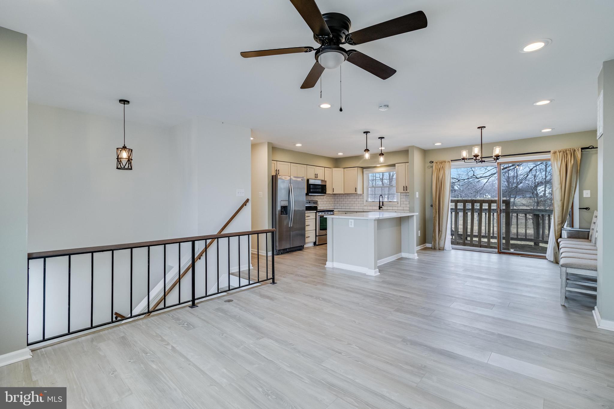 5510 Raphael Drive Pomfret, MD 20675 - Photo 3 of 10 a view of a kitchen with wooden floor and a window