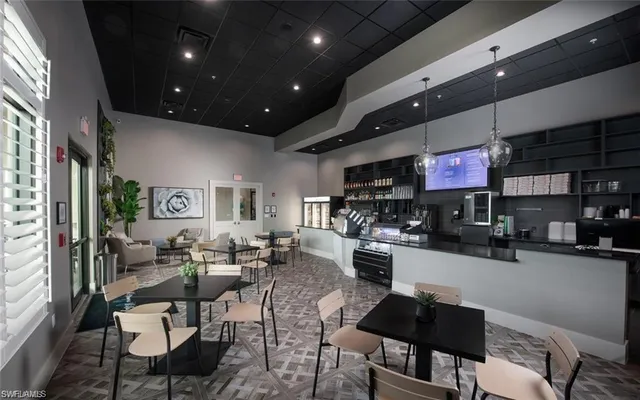 a living room with lots of furniture and a flat screen tv