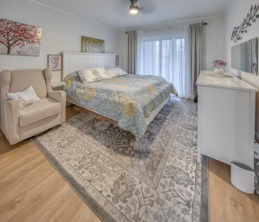 a spacious bedroom with a bed and a couch