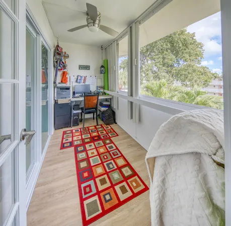 a view of a house with swimming pool and sitting area