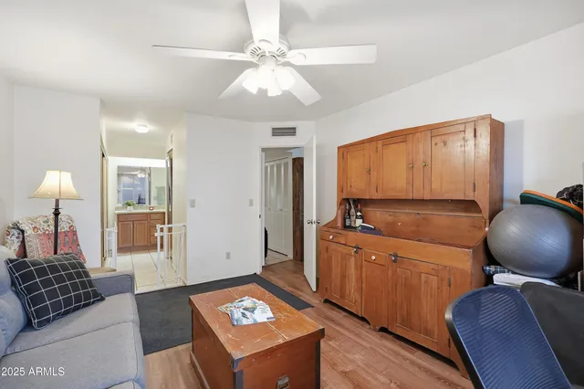 a living room with a couch and a chandelier