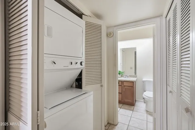 a bathroom with a toilet a sink and shower