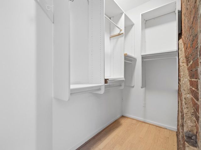 a view of an empty walk in closet