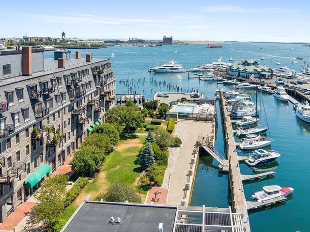 an aerial view of a house with a lake view