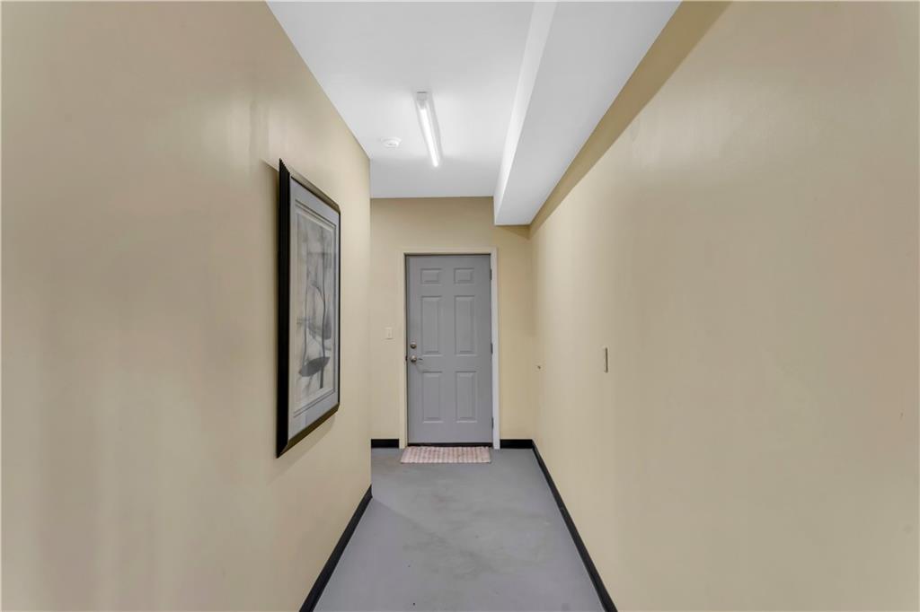 1225 Mercer Road Ellwood City, PA 16117 - Photo 29 of 36 This door leads connects the integral garage to the partially-finished basement.