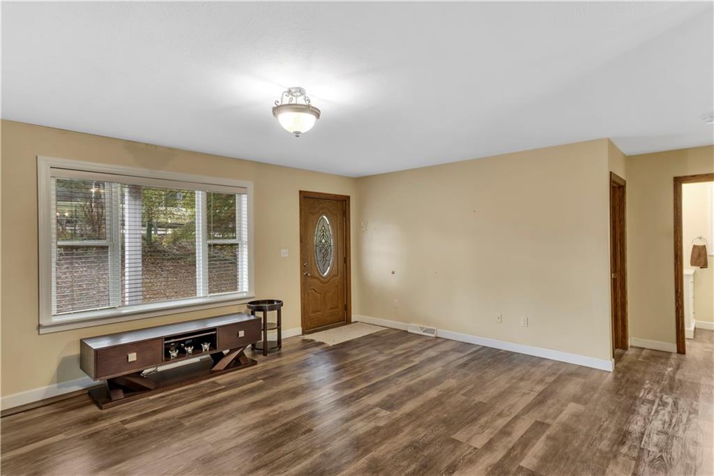 1225 Mercer Road Ellwood City, PA 16117 - Photo 5 of 36 The picture window in the living room invites natural light and scenic views.