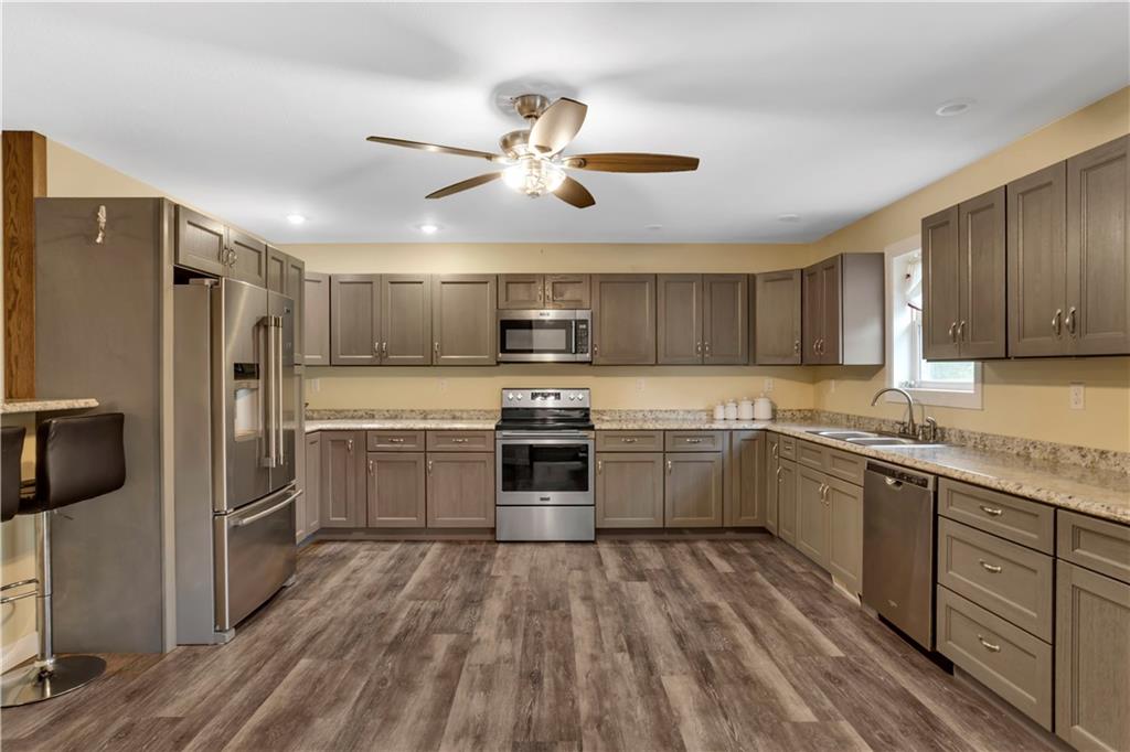 1225 Mercer Road Ellwood City, PA 16117 - Photo 10 of 36 - The kitchen boasts generous cabinet space for all your culinary essentials.