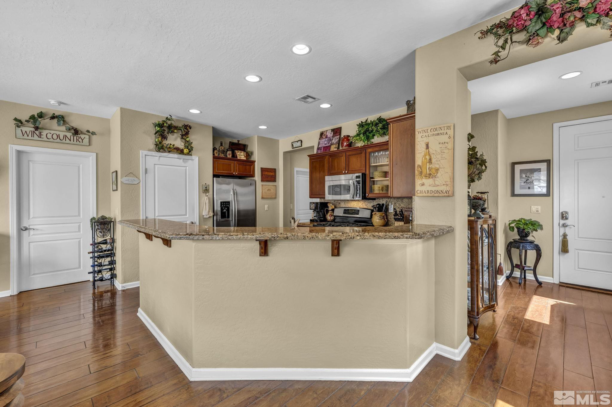 1925 Trail Creek Way Reno, NV 89523 - Photo 12 of 39 a view of kitchen with refrigerator stove and wooden floor