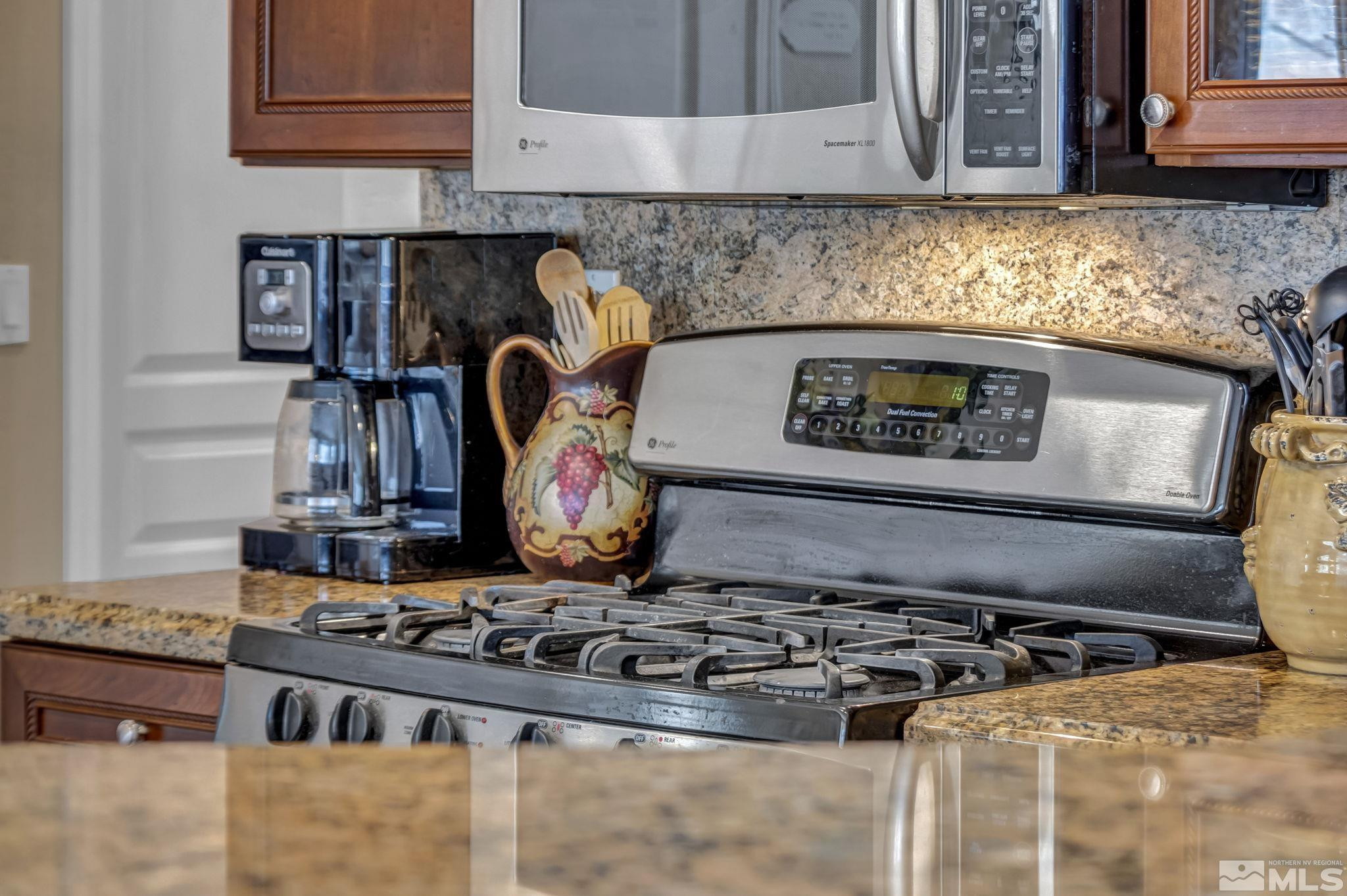 1925 Trail Creek Way Reno, NV 89523 - Photo 17 of 39 a kitchen with a stove and a microwave