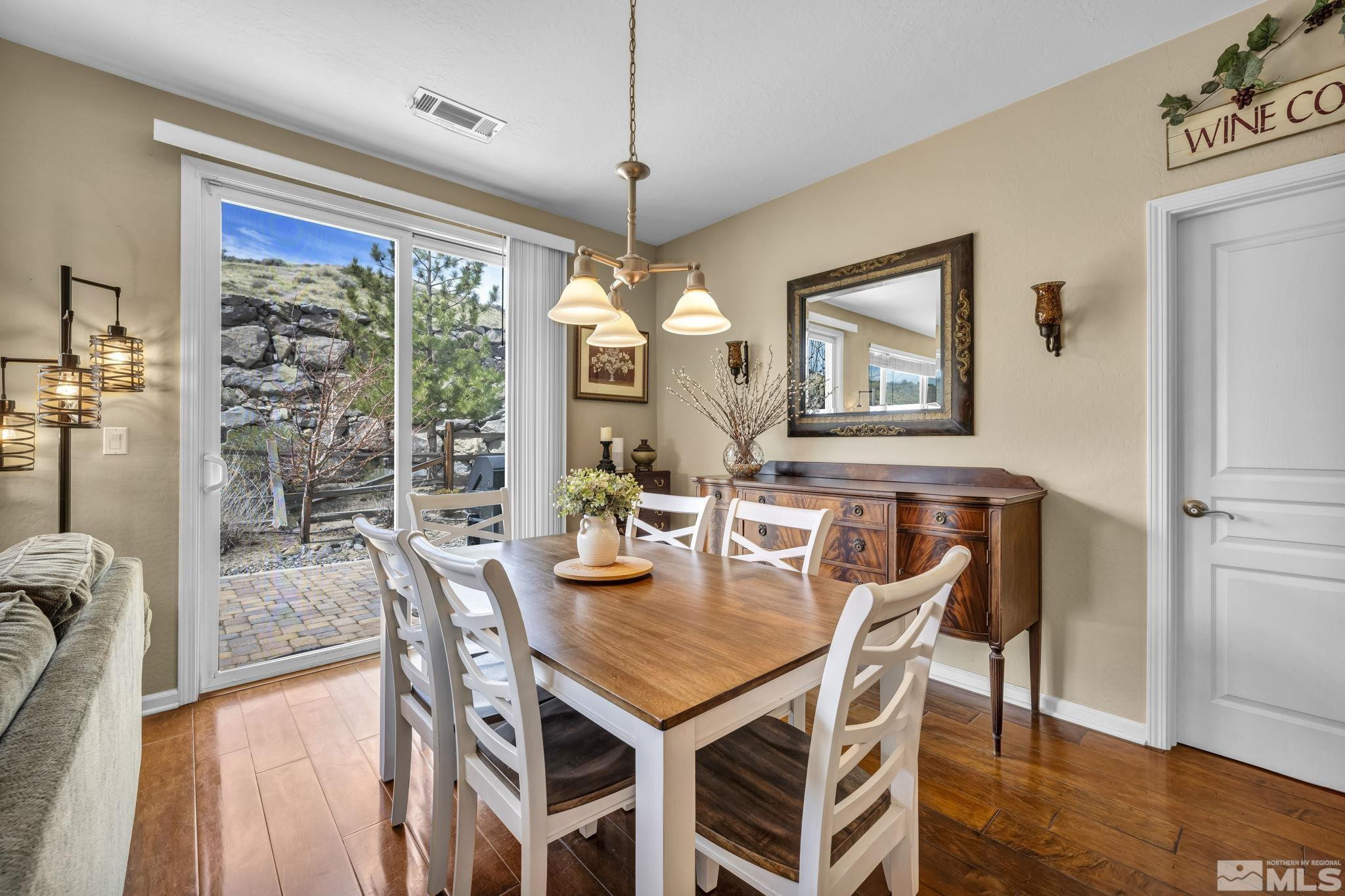 1925 Trail Creek Way Reno, NV 89523 - Photo 18 of 39 a view of a dining room with furniture window and wooden floor