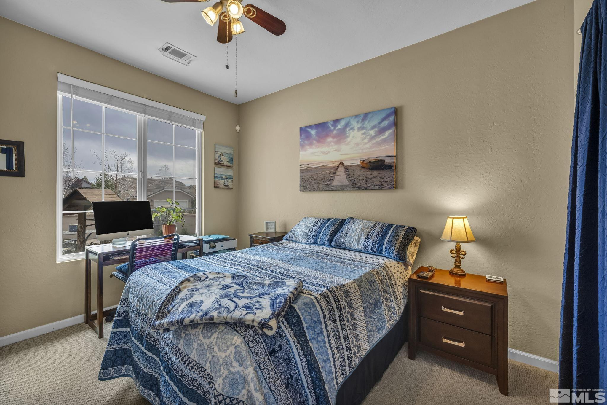 1925 Trail Creek Way Reno, NV 89523 - Photo 21 of 39 a bedroom with a bed and a chandelier