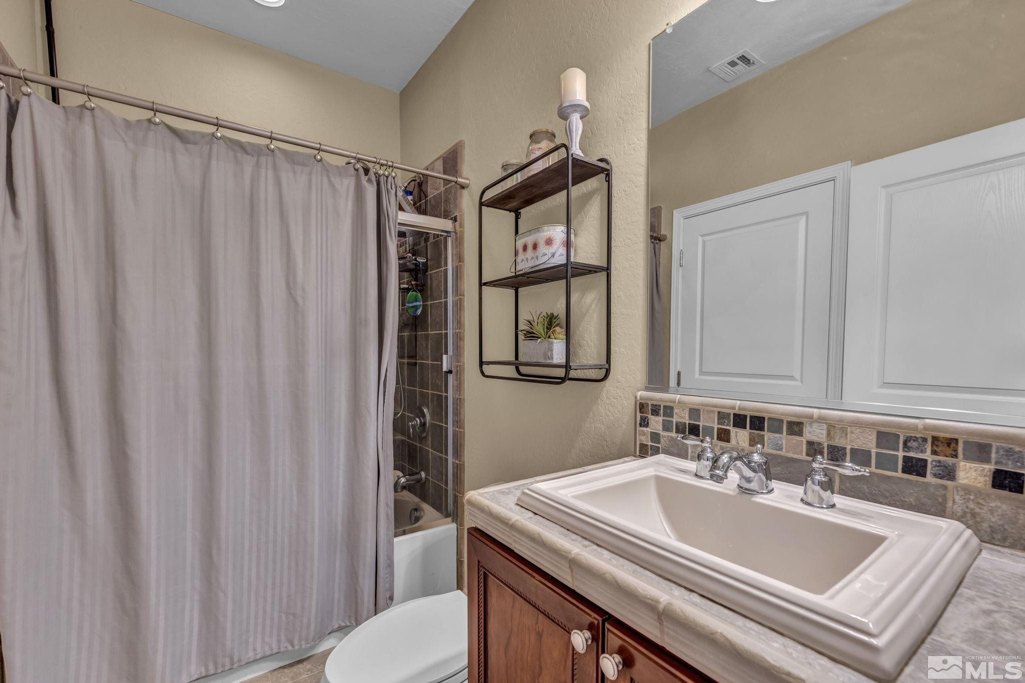 1925 Trail Creek Way Reno, NV 89523 - Photo 25 of 39 a bathroom with a sink and a mirror