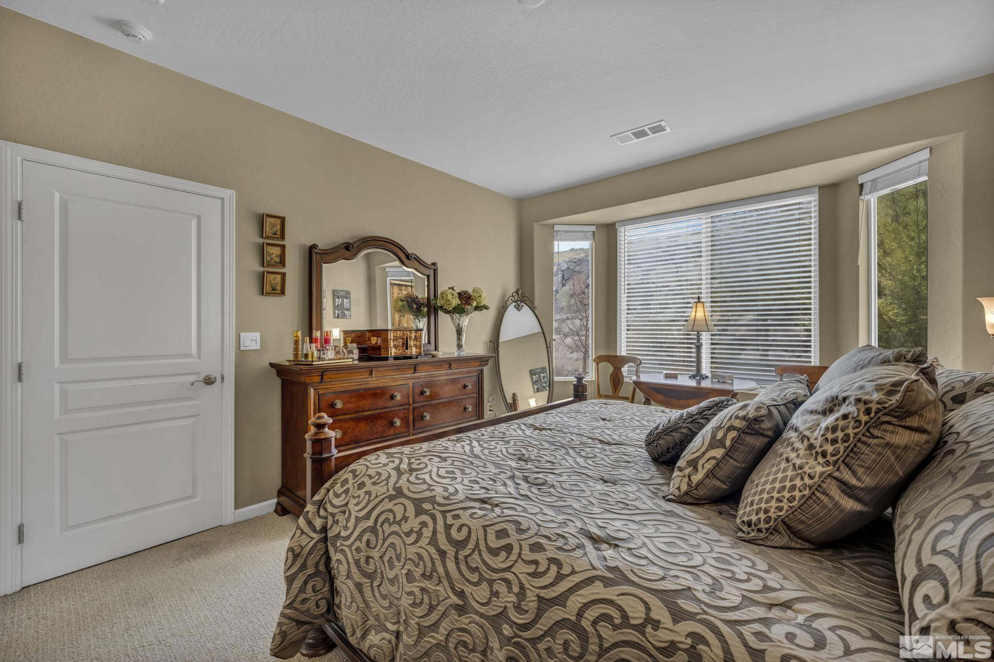 1925 Trail Creek Way Reno, NV 89523 - Photo 28 of 39 a bedroom with a bed and a large window