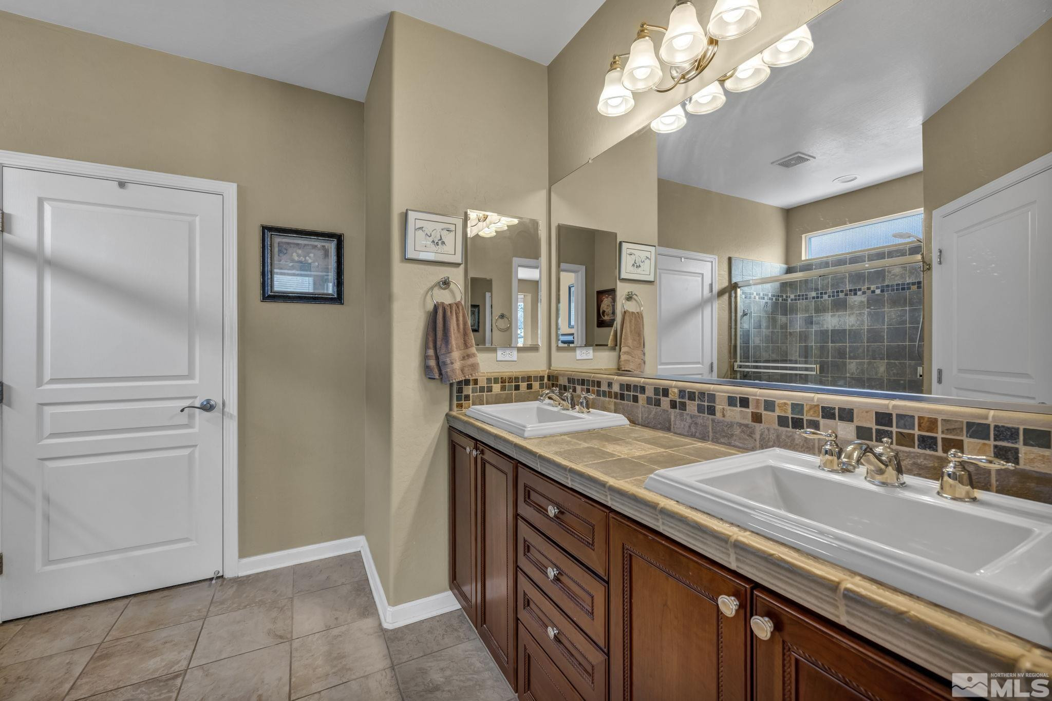 1925 Trail Creek Way Reno, NV 89523 - Photo 29 of 39 a bathroom with a sink double vanity and a mirror