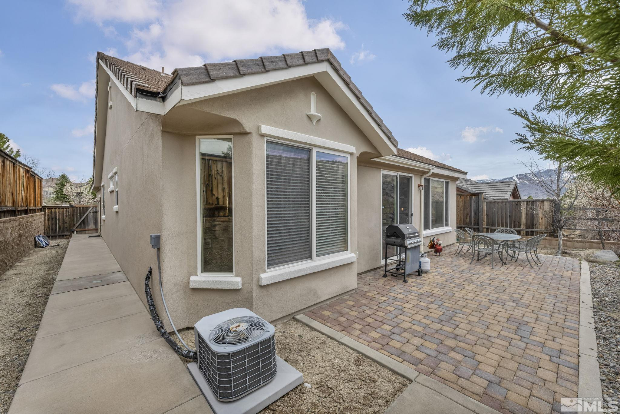 1925 Trail Creek Way Reno, NV 89523 - Photo 33 of 39 a view of a dinning table and chairs in patio of the house
