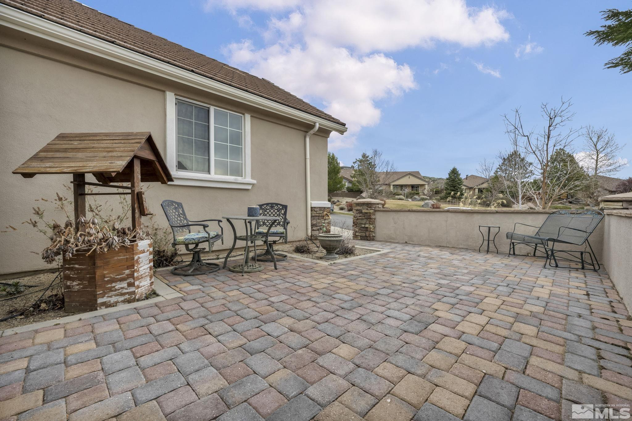 1925 Trail Creek Way Reno, NV 89523 - Photo 4 of 39 a backyard of a house with barbeque oven table and chairs