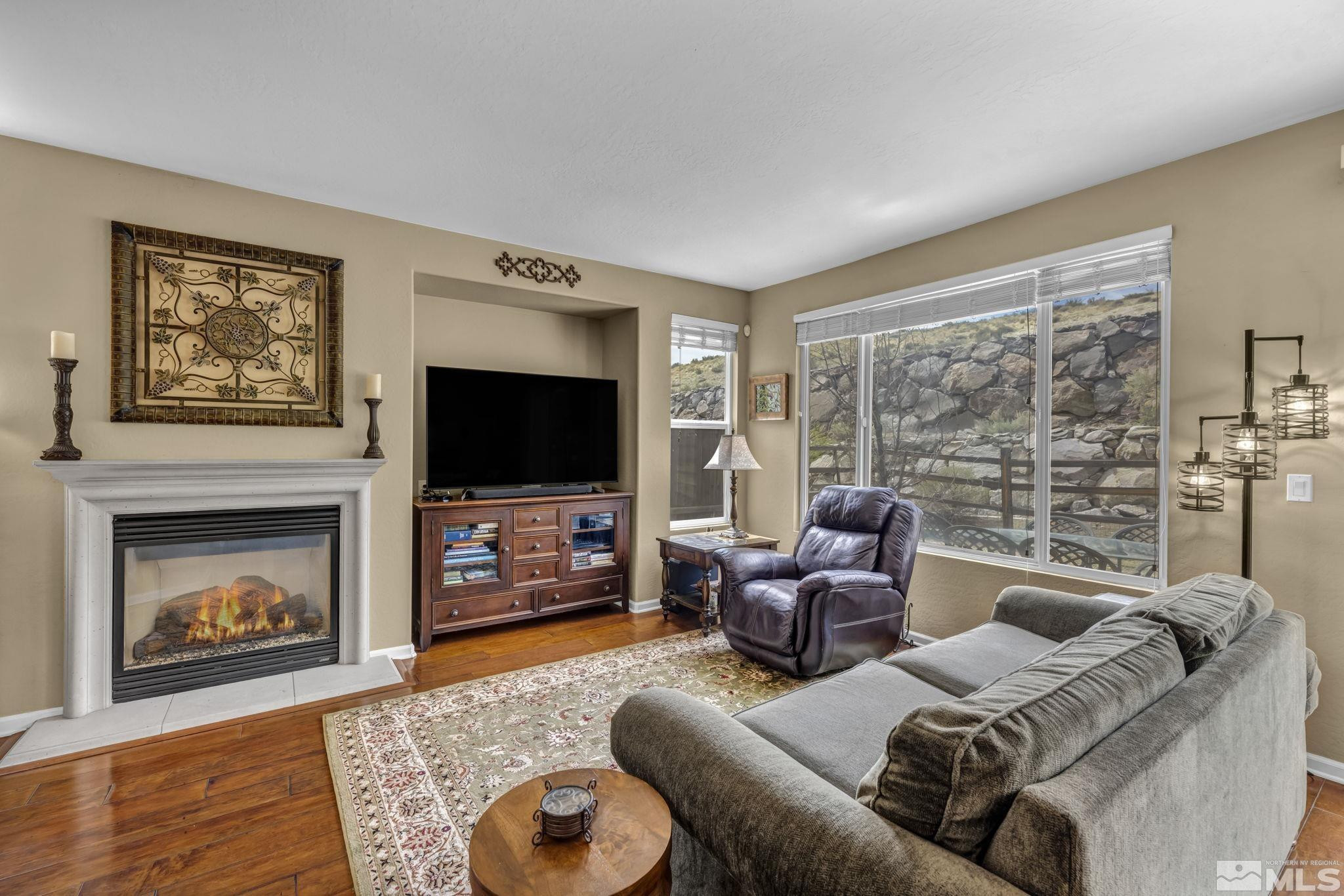1925 Trail Creek Way Reno, NV 89523 - Photo 8 of 39 a living room with furniture and a flat screen tv