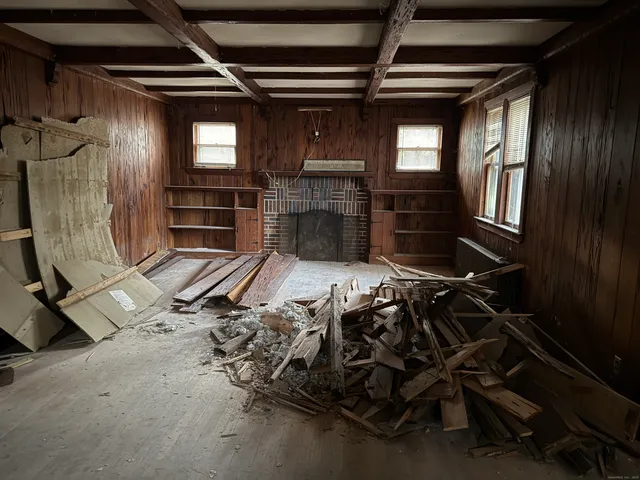 a bed sitting in a room next to a window