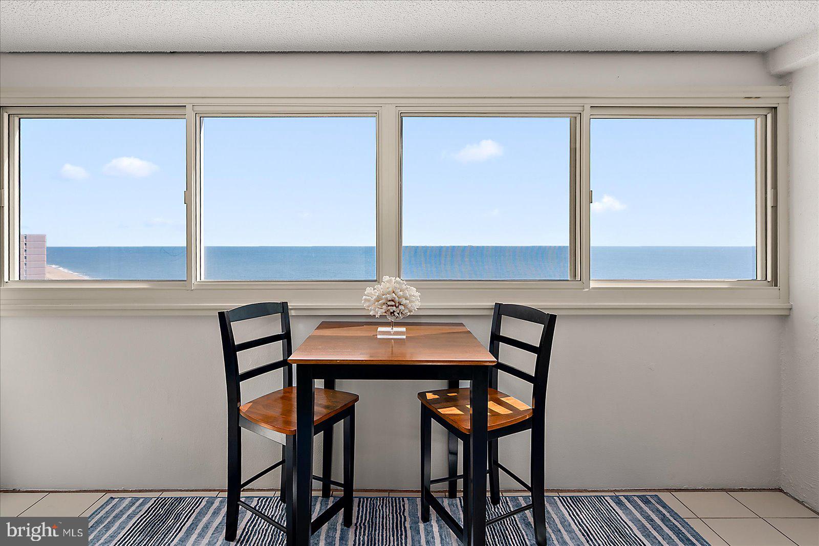 10300 Coastal Highway, Unit 1808 Ocean City, MD 21842 - Photo 1 of 47 a view of a dining room with furniture and window
