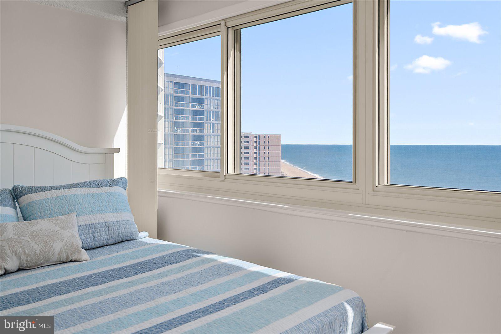 10300 Coastal Highway, Unit 1808 Ocean City, MD 21842 - Photo 21 of 47 a bedroom with a bed and a window