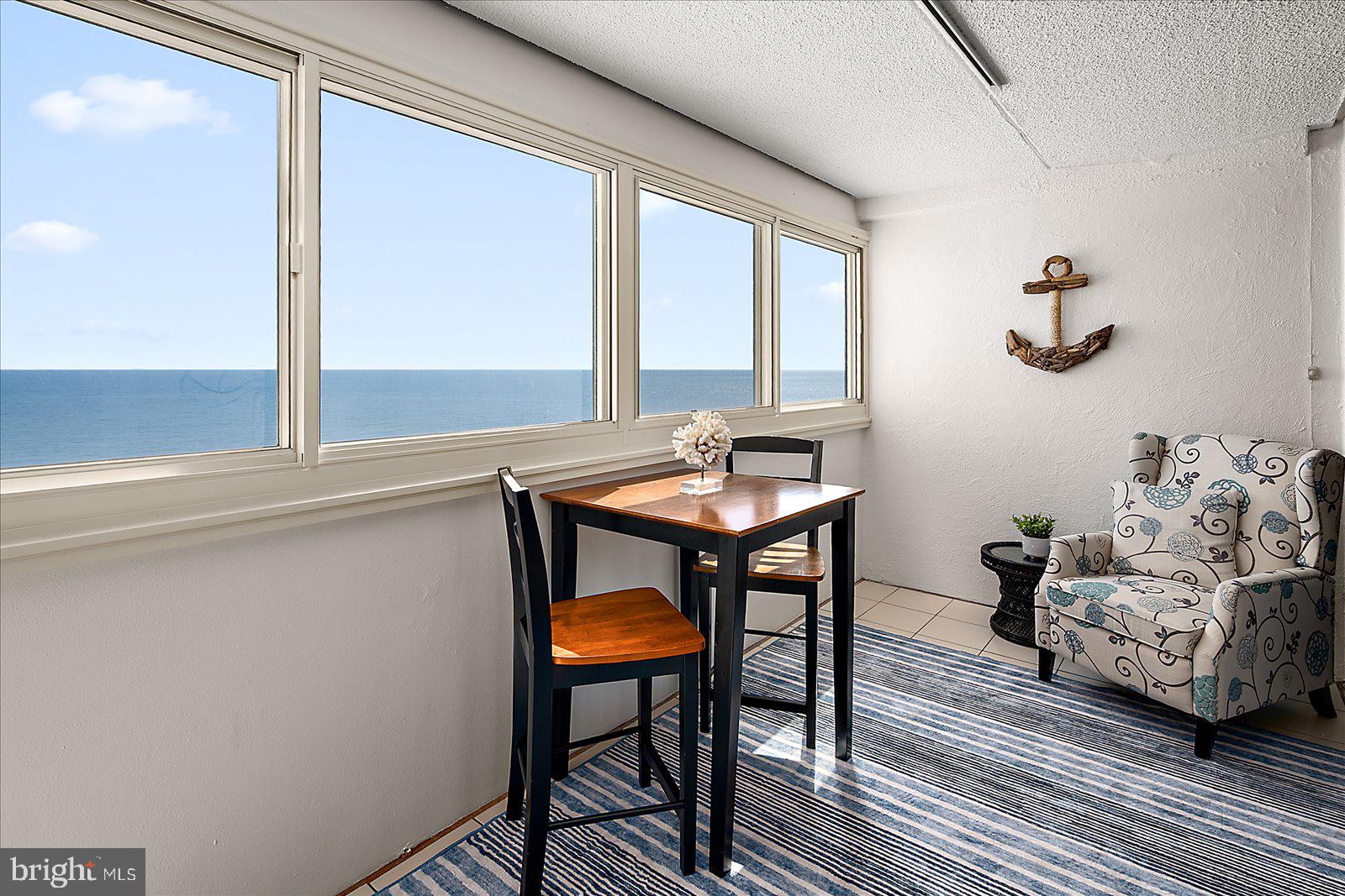 10300 Coastal Highway, Unit 1808 Ocean City, MD 21842 - Photo 36 of 47 a living room with furniture and a window