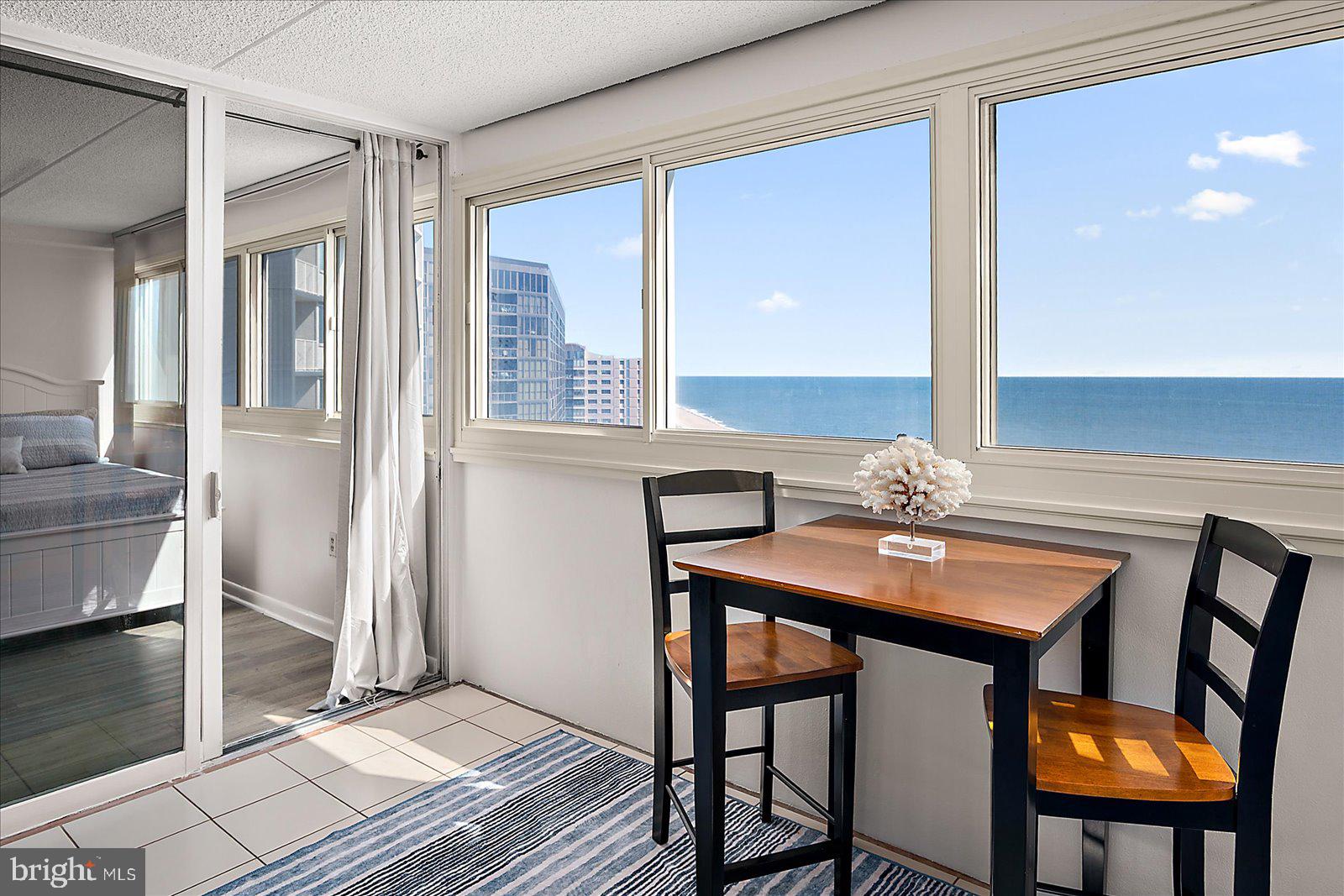 10300 Coastal Highway, Unit 1808 Ocean City, MD 21842 - Photo 6 of 47 a view of a dining room with furniture and window