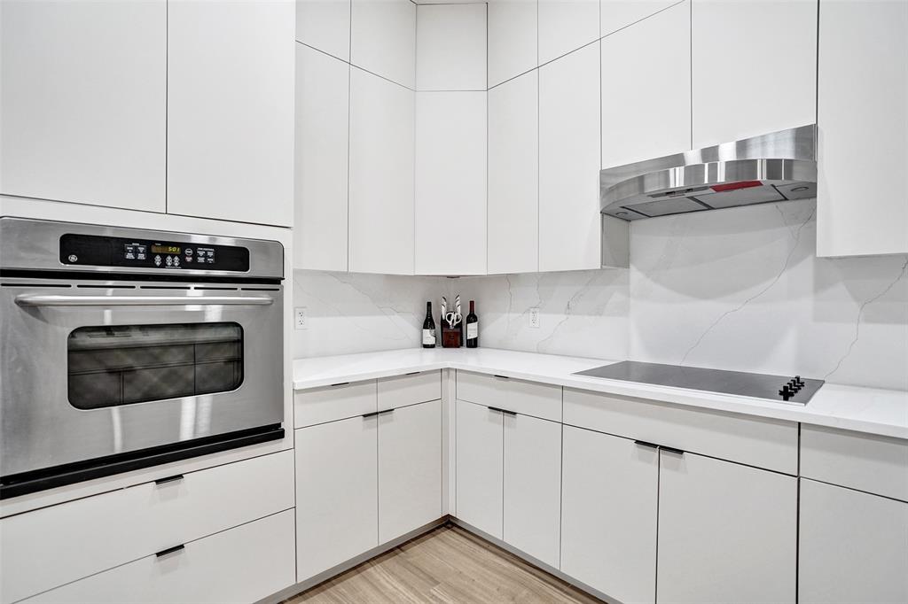 230 Northeast 69th Circle, Unit 230 Boca Raton, FL 33487 - Photo 15 of 91 a kitchen with cabinets stainless steel appliances and a counter space