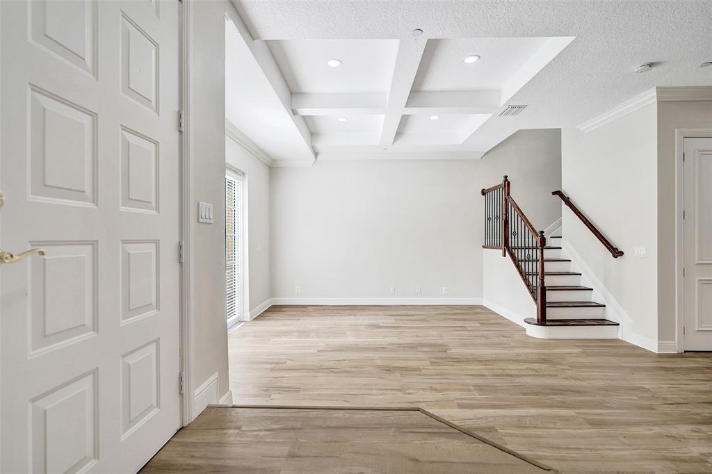 230 Northeast 69th Circle, Unit 230 Boca Raton, FL 33487 - Photo 16 of 91 a view of entryway and hall with wooden floor