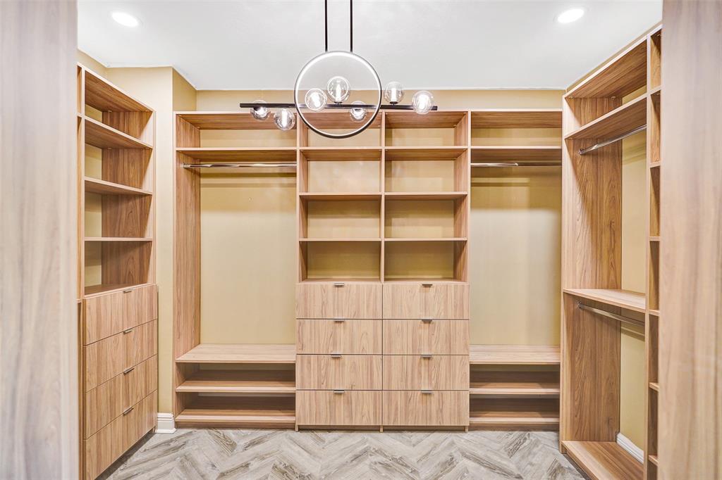230 Northeast 69th Circle, Unit 230 Boca Raton, FL 33487 - Photo 41 of 91 a view of walk in closet with empty racks