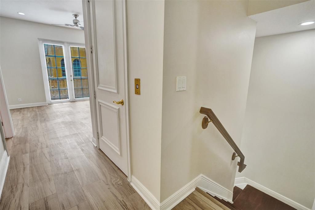 230 Northeast 69th Circle, Unit 230 Boca Raton, FL 33487 - Photo 51 of 91 a view of a hallway with wooden floor and staircase