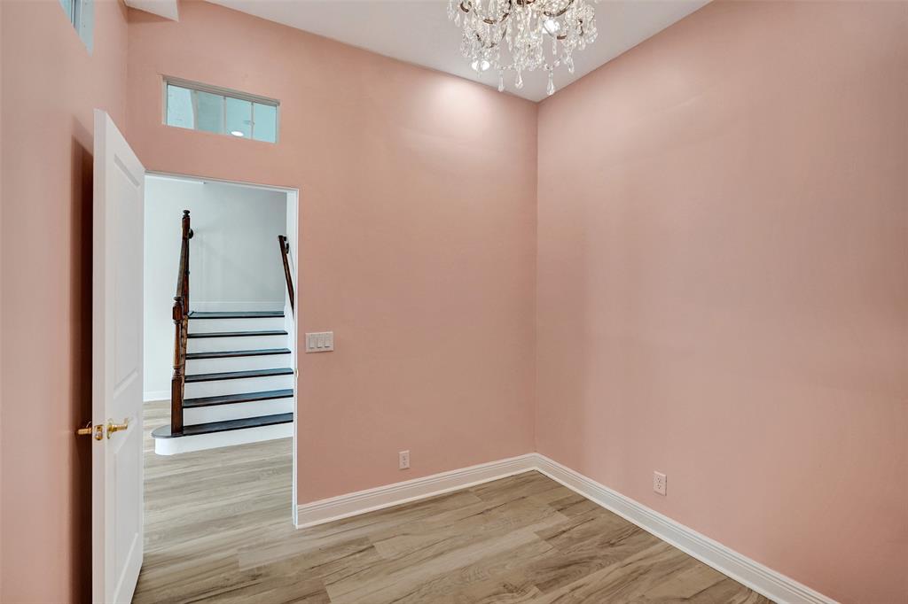 230 Northeast 69th Circle, Unit 230 Boca Raton, FL 33487 - Photo 57 of 91 a view of a hallway with stairs and wooden floor