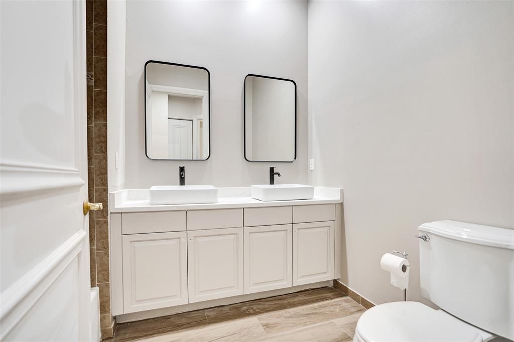 230 Northeast 69th Circle, Unit 230 Boca Raton, FL 33487 - Photo 68 of 91 a bathroom with a toilet sink and mirror