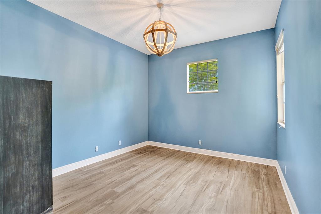 230 Northeast 69th Circle, Unit 230 Boca Raton, FL 33487 - Photo 74 of 91 a view of a room with wooden floor and windows