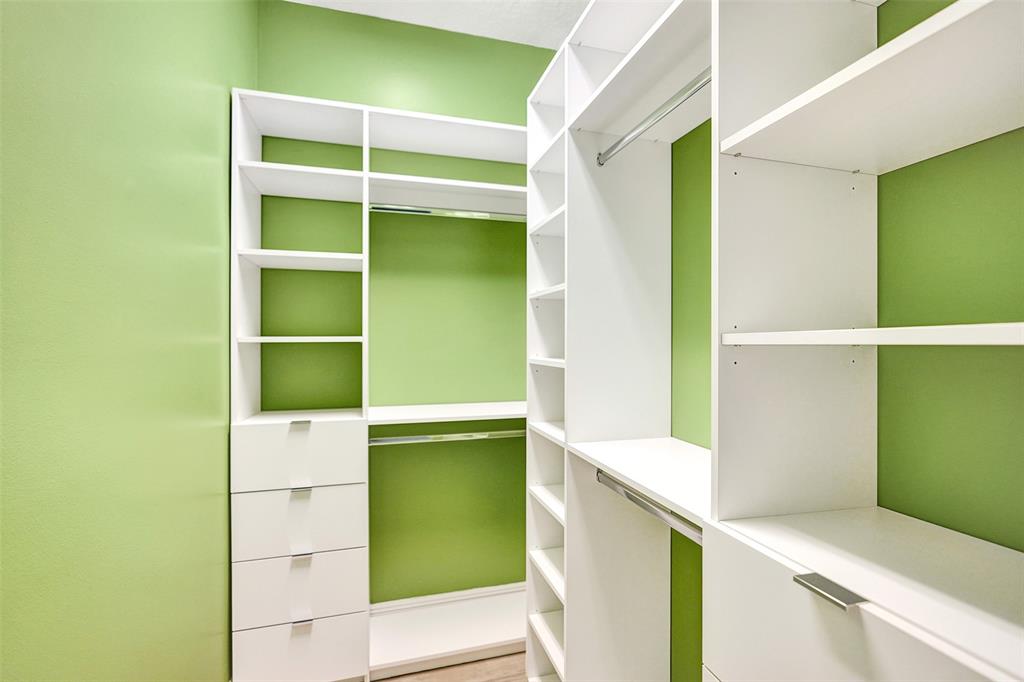 230 Northeast 69th Circle, Unit 230 Boca Raton, FL 33487 - Photo 77 of 91 a view of walk in closet with empty racks