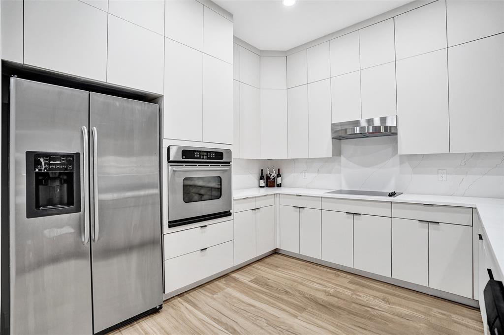 230 Northeast 69th Circle, Unit 230 Boca Raton, FL 33487 - Photo 9 of 91 a kitchen with cabinets stainless steel appliances and a counter space