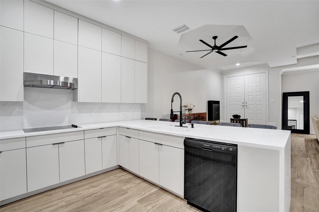 230 Northeast 69th Circle, Unit 230 Boca Raton, FL 33487 - Photo 10 of 91 a kitchen with a sink cabinets and appliances