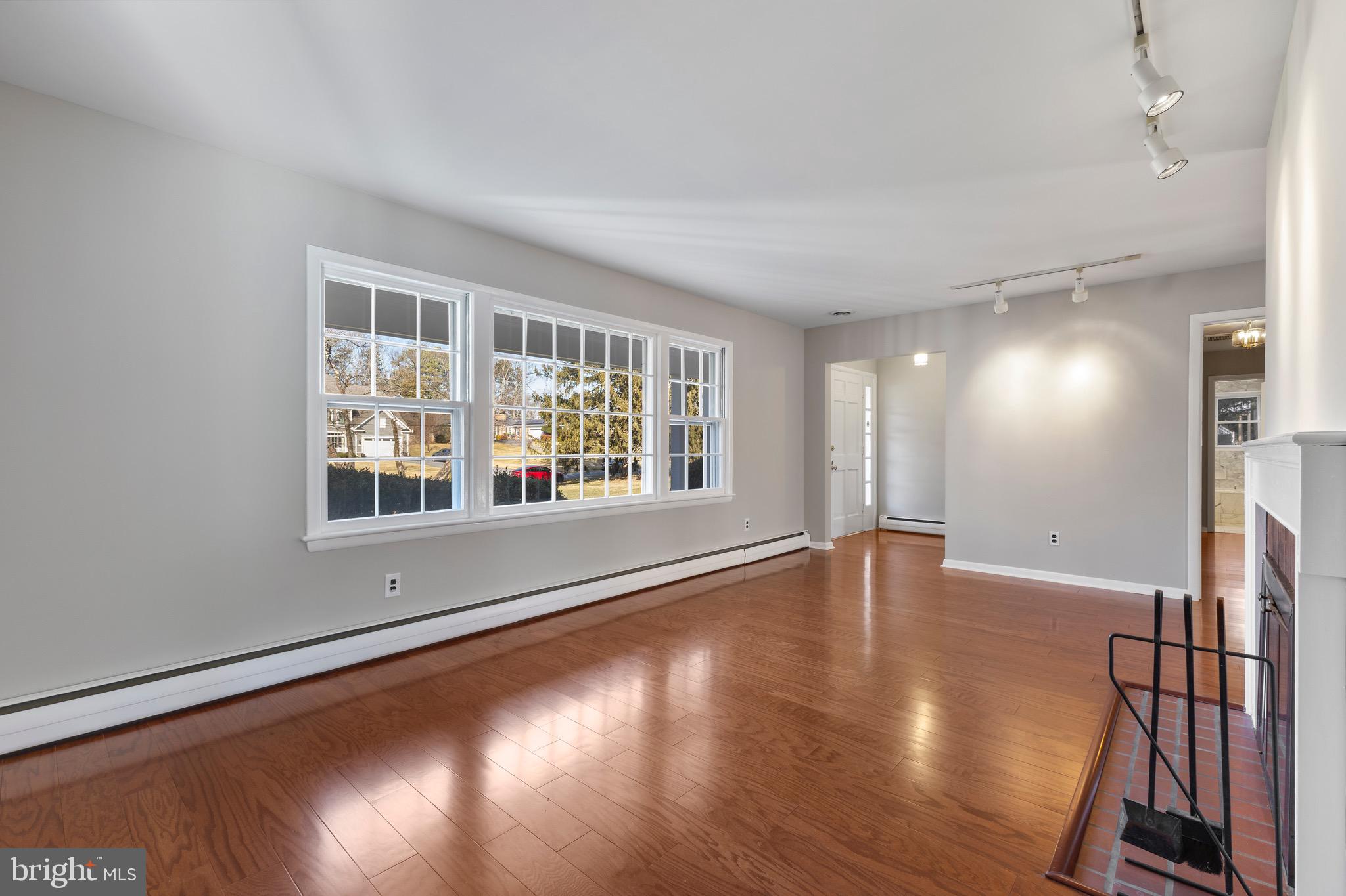 412 Vierling Drive Silver Spring, MD 20904 - Photo 13 of 35 an empty room with wooden floor and windows