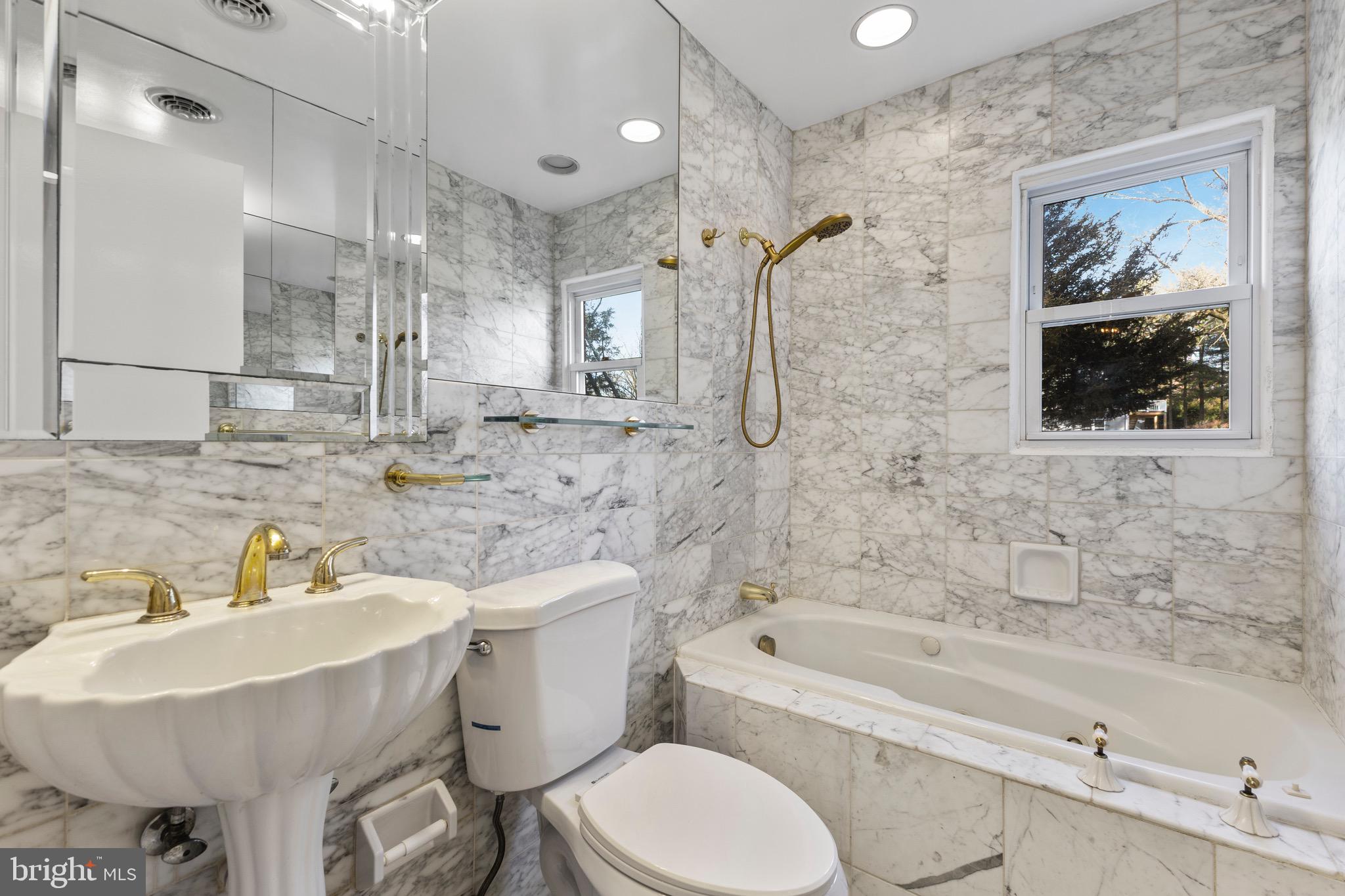 412 Vierling Drive Silver Spring, MD 20904 - Photo 16 of 35 a bathroom with a sink toilet and shower