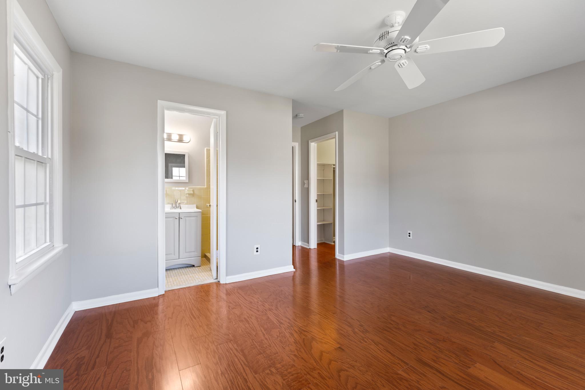412 Vierling Drive Silver Spring, MD 20904 - Photo 19 of 35 an empty room with wooden floor and windows