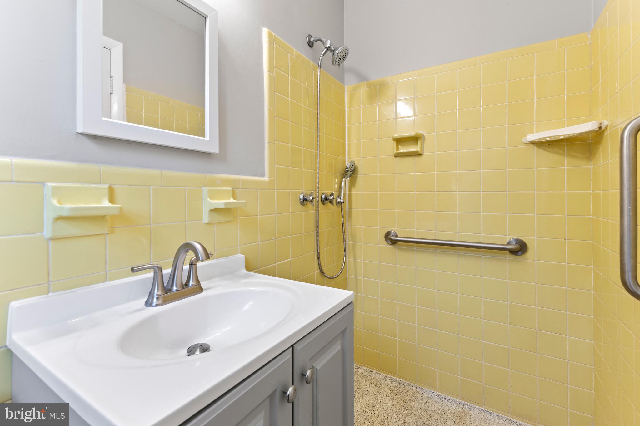 412 Vierling Drive Silver Spring, MD 20904 - Photo 21 of 35 a bathroom with a sink a shower and a mirror